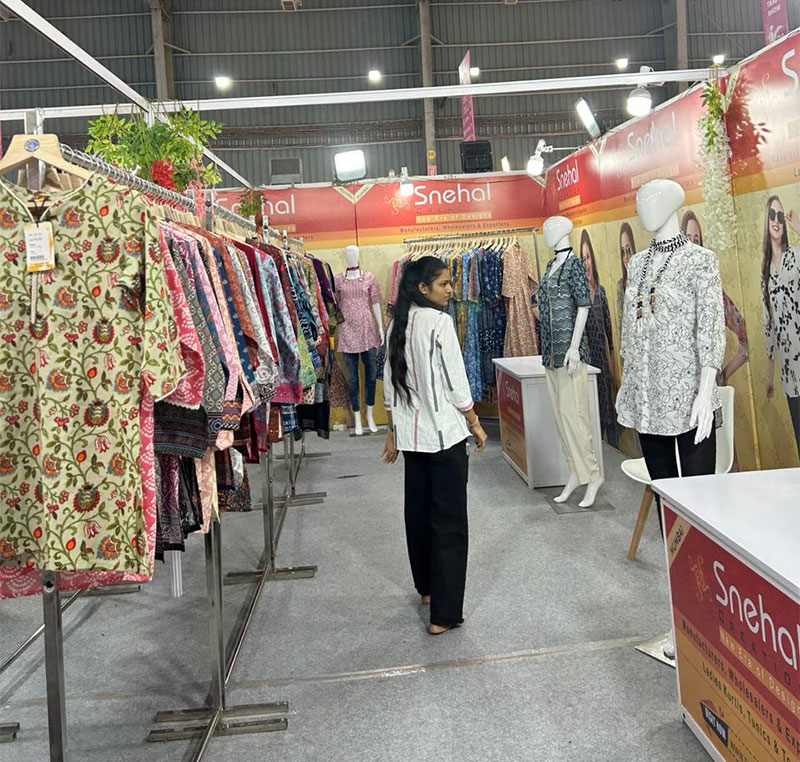 Snehal Creation team meeting wholesale buyers at CMAI National Garment Fair 2024, Mumbai