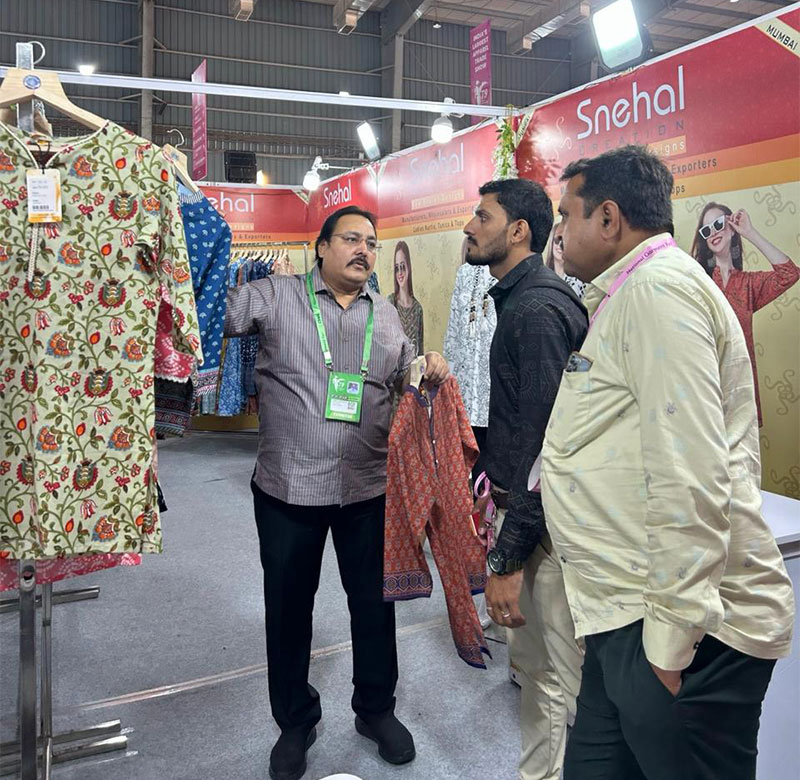 Snehal Creation stall display of ladies kurtis and tunics at CMAI 2024, Bombay Exhibition Centre