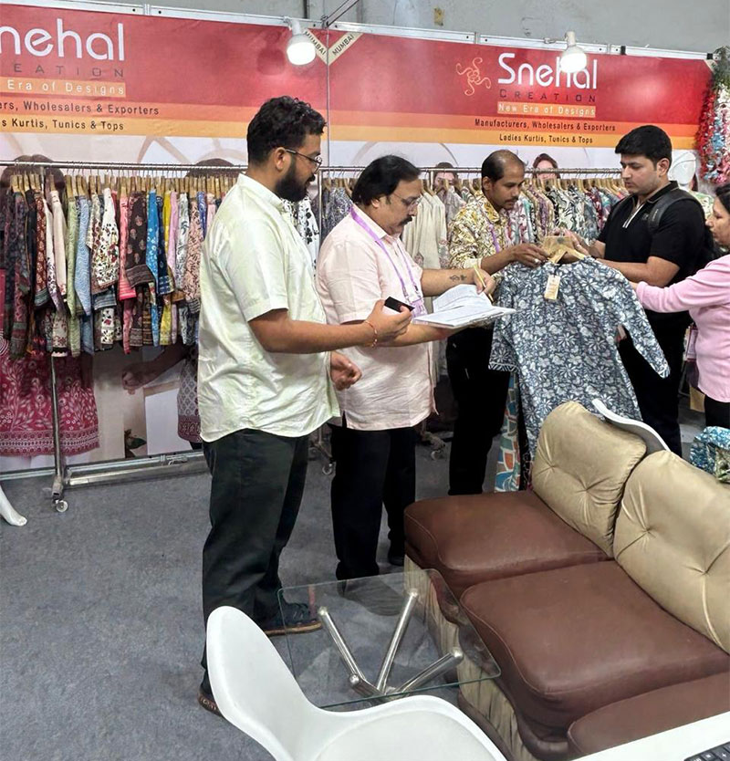 Buyers reviewing Snehal Creation kurtis at CMAI 81st National Garment Fair 2025, Mumbai